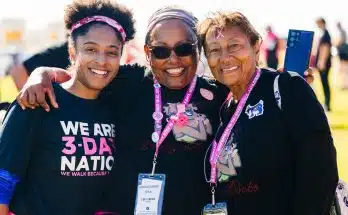 a group of women standing next to each other